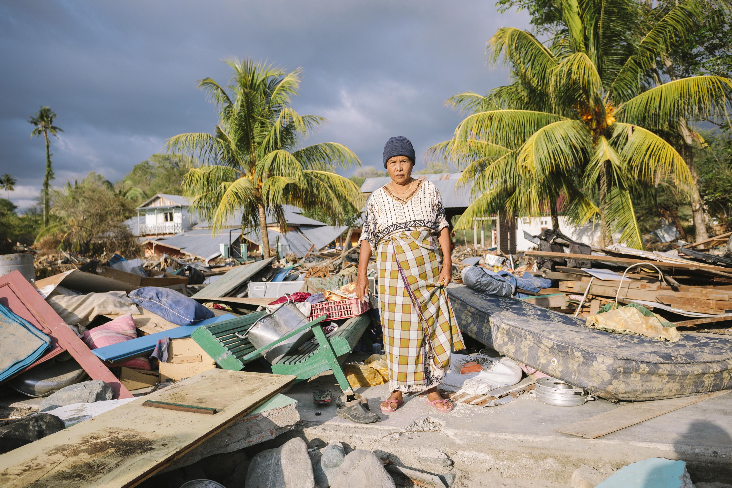 Ernawati, 60, lost everything when the tsunami destroyed her home. She is now living in a small temporary room at her neighbours house. Photo: Benjamin Suomela/Finnish Red Cross